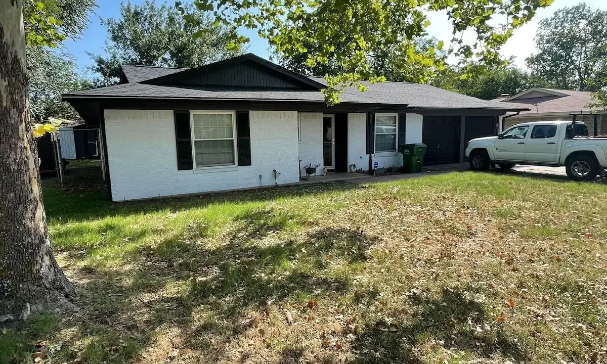 Professional roofing crew working on a residential roof in Sea Cliff